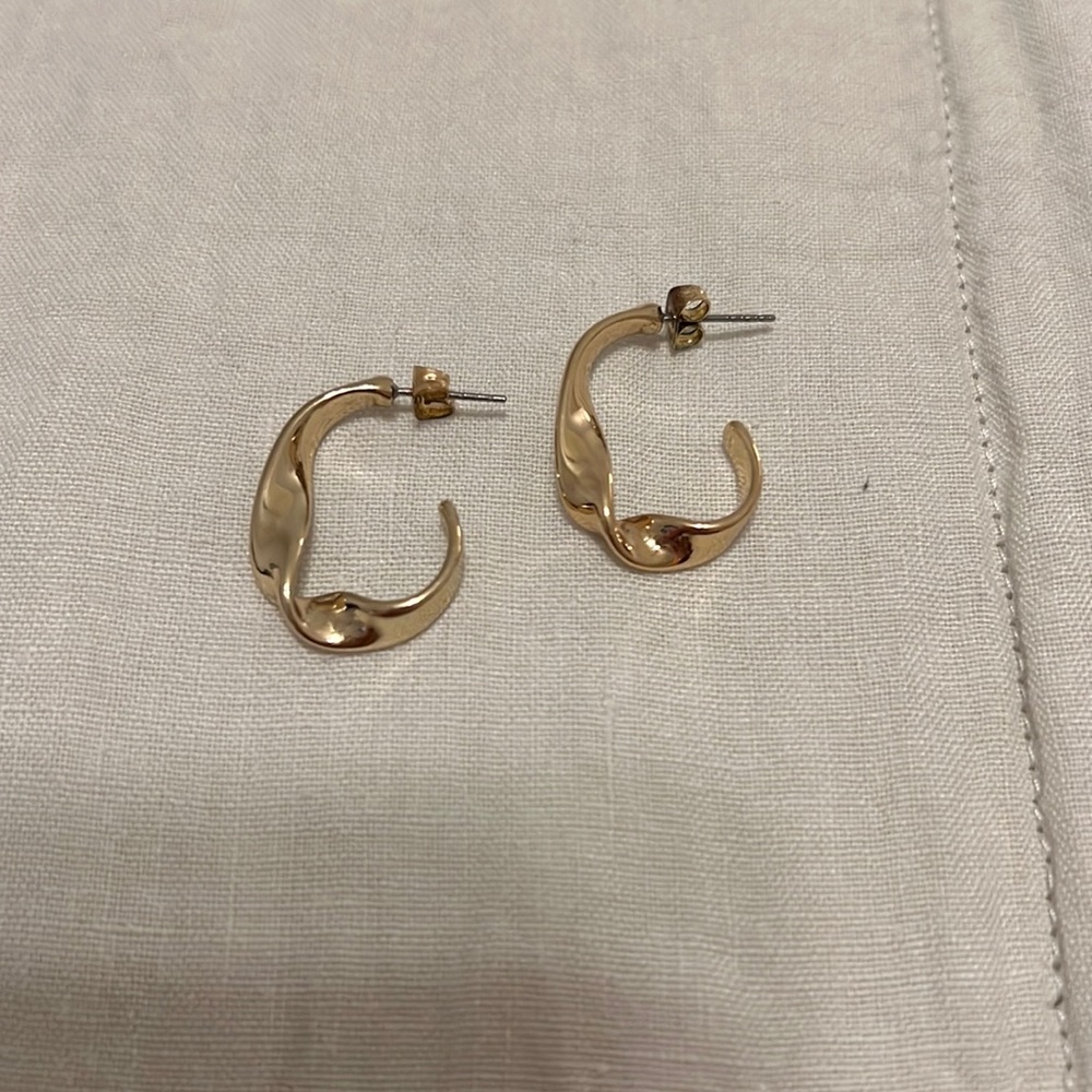 Gold colored twisted hoop earrings